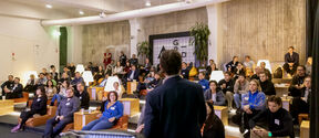 Speaker and attendees at Demo Day 2025